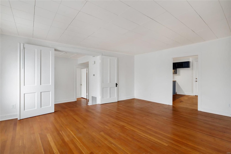 Second floor apartment. Unfurnished room with hardwood / wood-style flooring