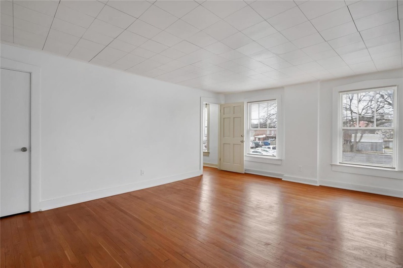 Second floor apartment. Unfurnished room featuring plenty of natural light and light wood-type flooring