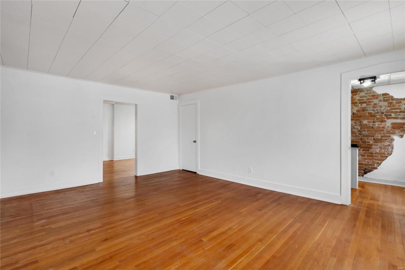Second floor apartment. Empty room featuring hardwood / wood-style floors