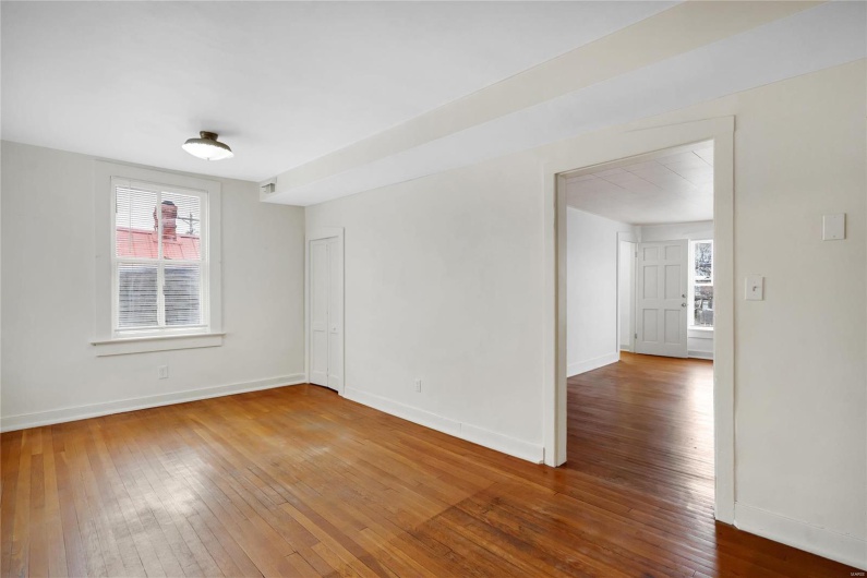 Second floor apartment. Spare room with wood-type flooring