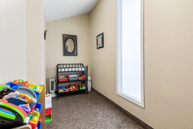 Game room featuring lofted ceiling and carpet flooring