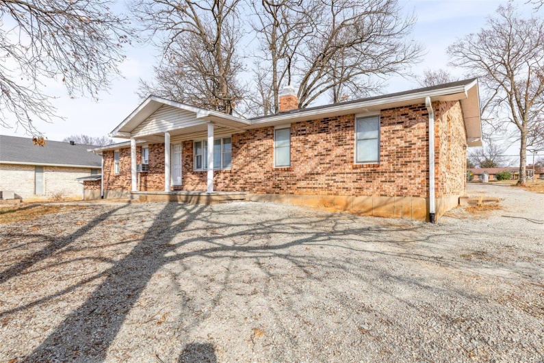 Single story home featuring a porch