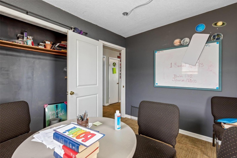 Dining space featuring carpet floors and a textured ceiling