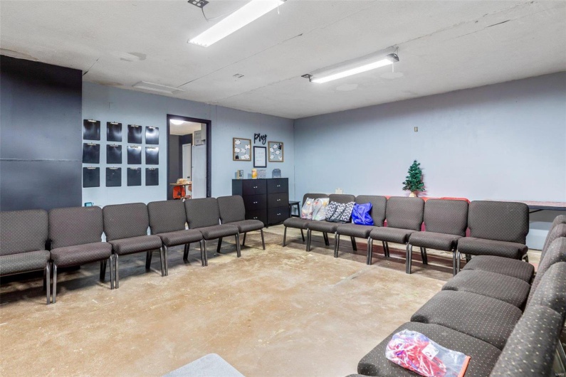 Living room featuring concrete flooring