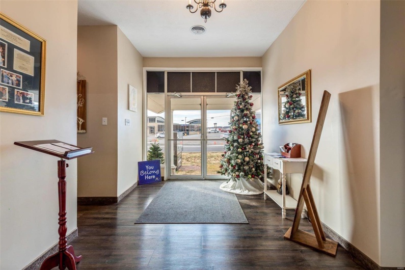 Foyer entrance with dark hardwood / wood-style floors