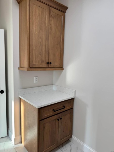 Kitchen with light stone countertops