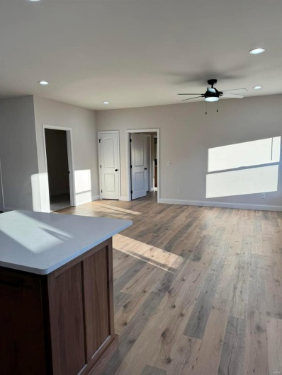 Kitchen featuring ceiling fan and hardwood / wood-style floors
