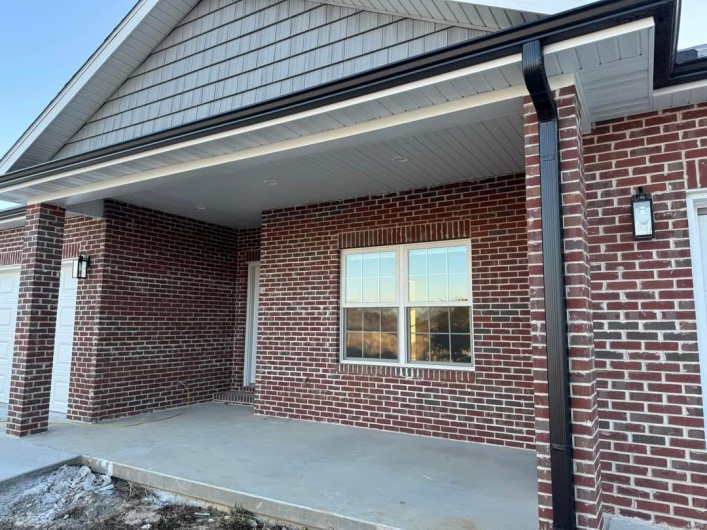 View of property exterior featuring a patio area