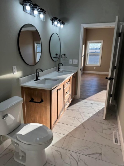 Bathroom with vanity and toilet