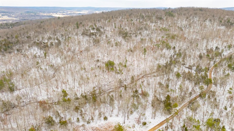 Snowy aerial view with a mountain view