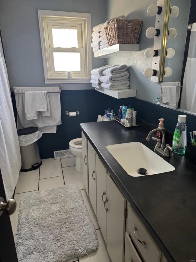 Bathroom featuring toilet and vanity
