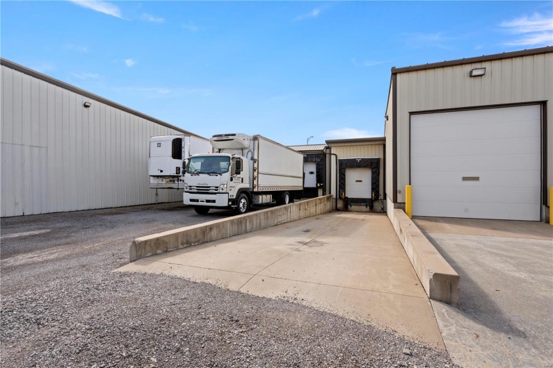 View of vehicle parking with a garage