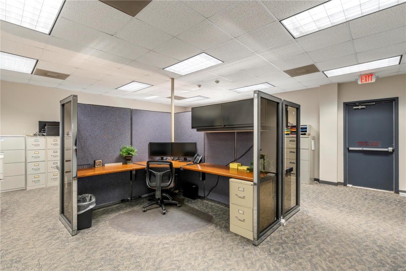 Carpeted home office featuring a paneled ceiling