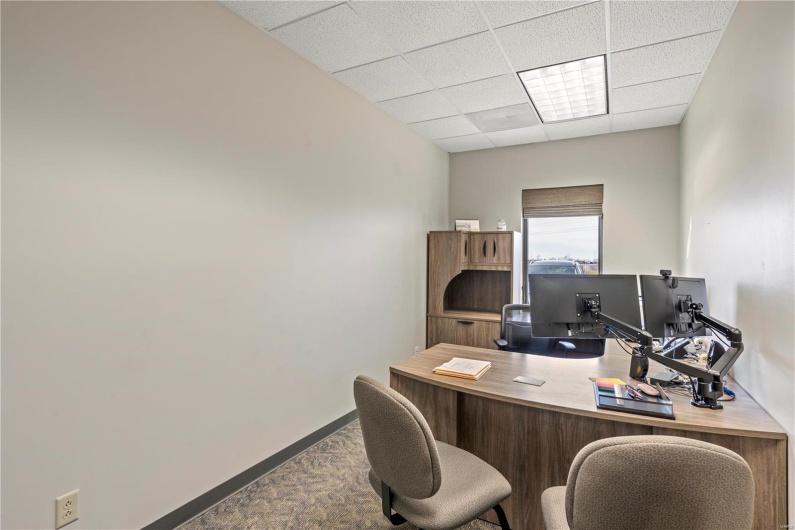 Office featuring a drop ceiling