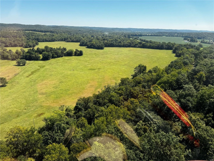 Birds eye view of property with a rural view