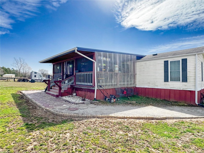 Nice front porch with lots of storage, electrical outlets, and great for outside living area! 