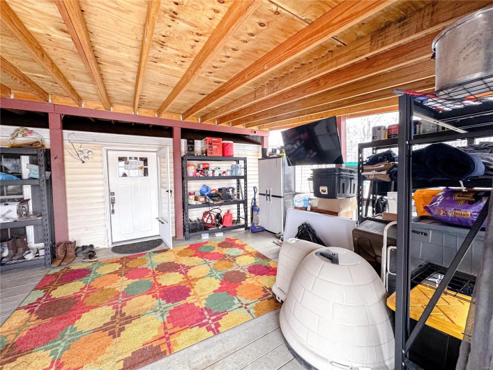 Front covered porch area! Great for entertaining or storage 
