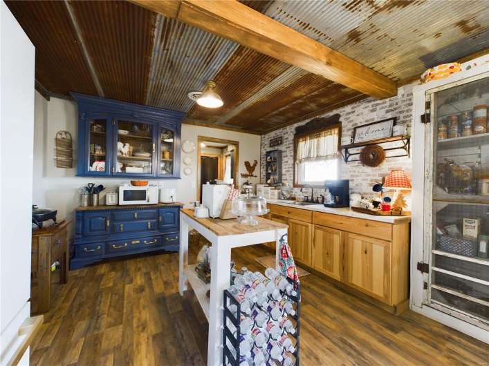 Kitchen featuring sink, dark hardwood / wood-style floors, and blue cabinets
