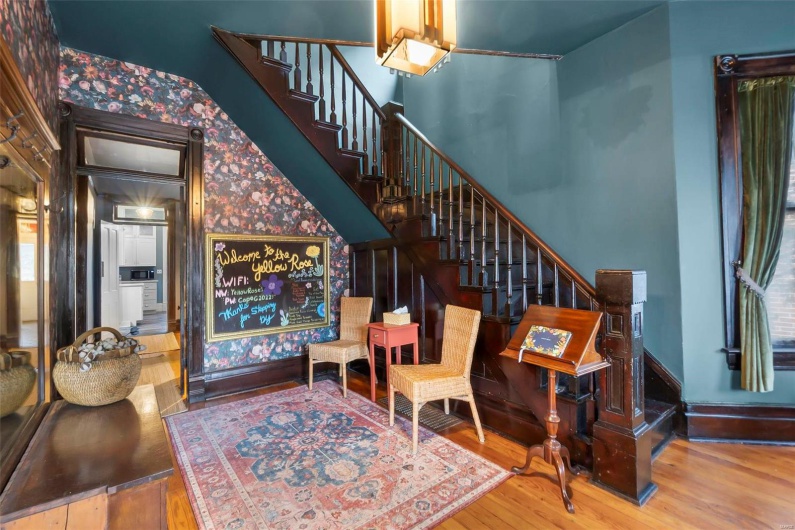 Foyer entrance with hardwood floors