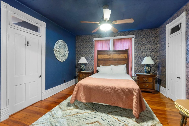 Bedroom featuring hardwood  flooring and ceiling fan