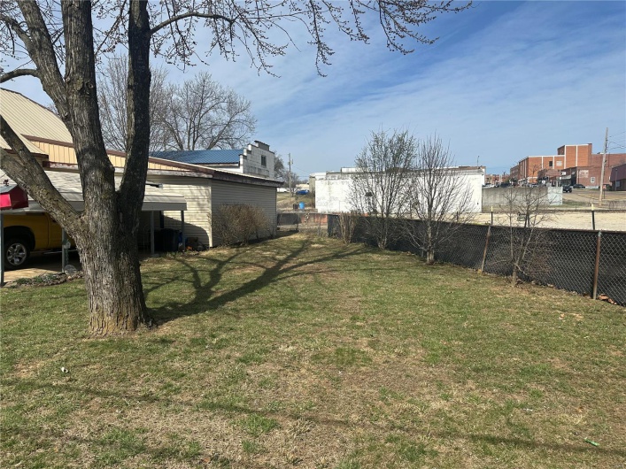 View of yard featuring fence