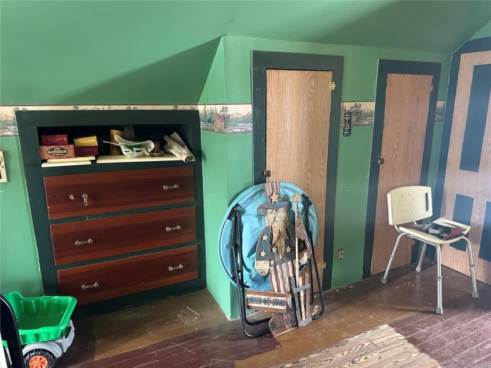 Bedroom with wood finished floors