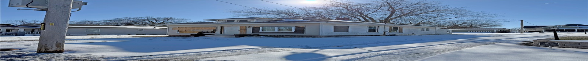 Residential For Sale View of front of property featuring central air condition unit, a chimney, and a residential view