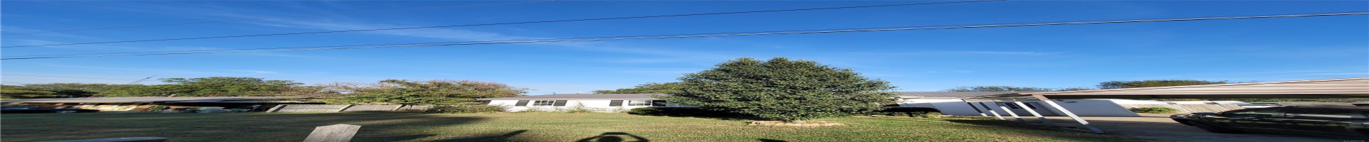 Residential For Sale View of front of house featuring fence, metal roof, a carport, and a front yard