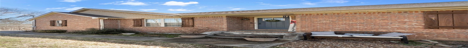 Residential For Sale Doorway to property with brick siding and roof with shingles