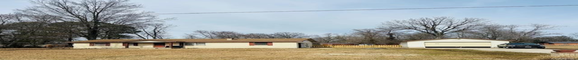 Residential For Sale Ranch-style house featuring an outbuilding, a front lawn, and a garage