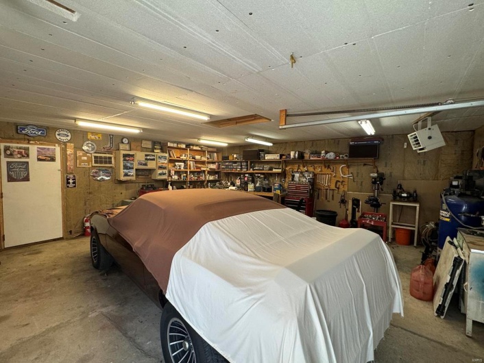 Garage featuring a workshop area
