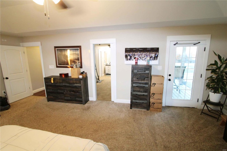 Bedroom with carpet and baseboards