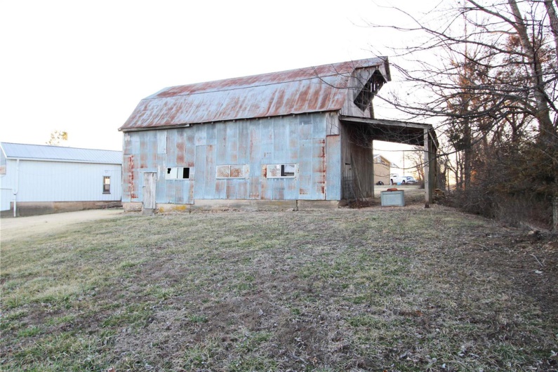 View of barn with a yard