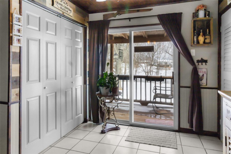 Doorway to outside with light tile patterned floors