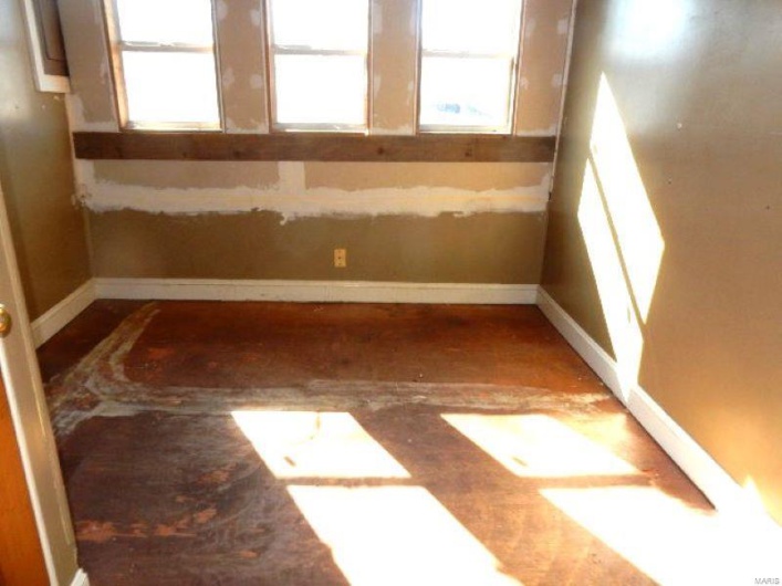 Spare room featuring baseboards