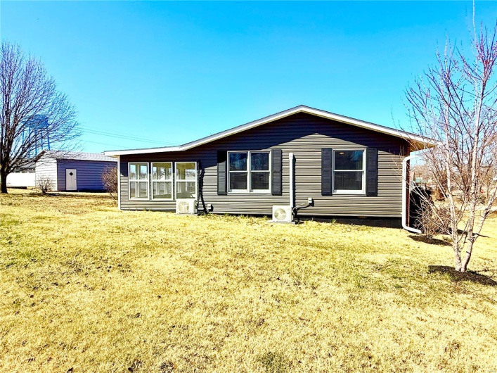 View of front of house featuring a front yard and a sunroom