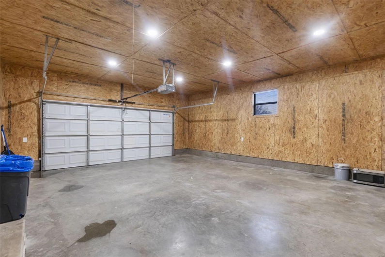 Garage featuring a garage door opener