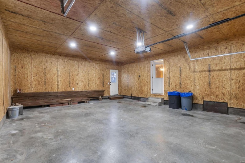 Garage featuring a garage door opener