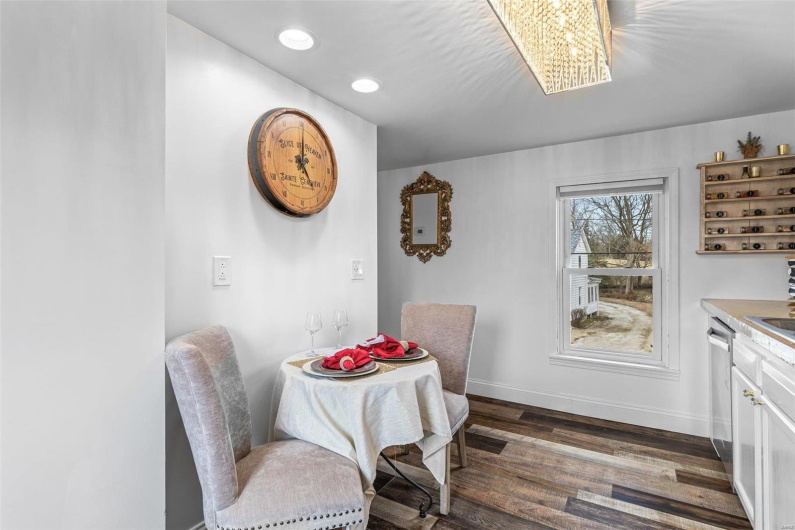 Dining room with dark wood-style floors, recessed lighting, and baseboards