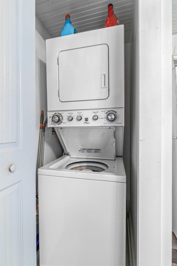 Clothes washing area with laundry area and stacked washer / drying machine