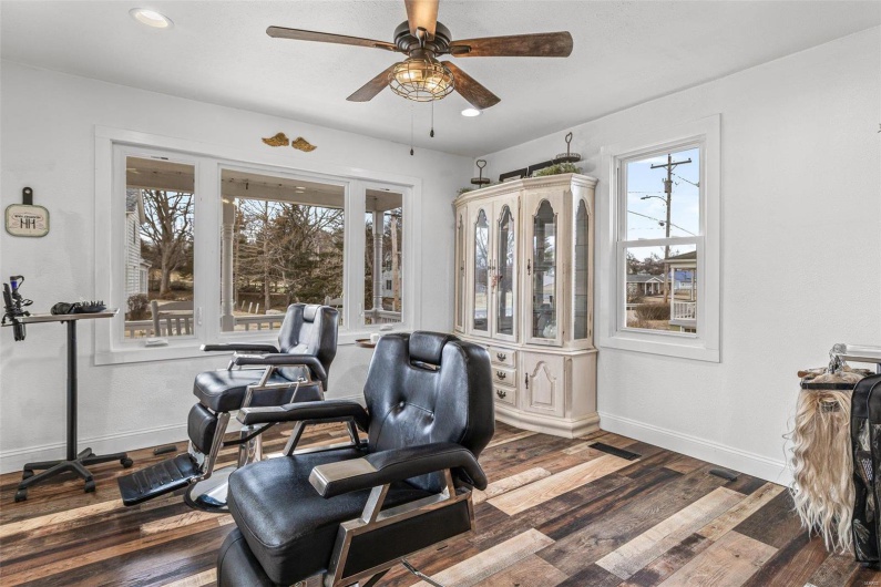 Home office featuring a ceiling fan, recessed lighting, dark wood-style flooring, and baseboards