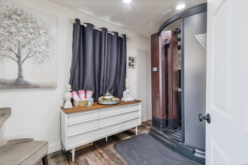 Mudroom with baseboards, wood finished floors, and recessed lighting