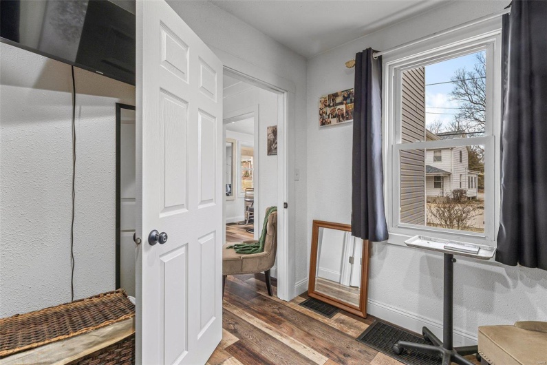 Bathroom featuring visible vents, baseboards, and wood finished floors