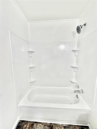 Full bathroom with shower / washtub combination