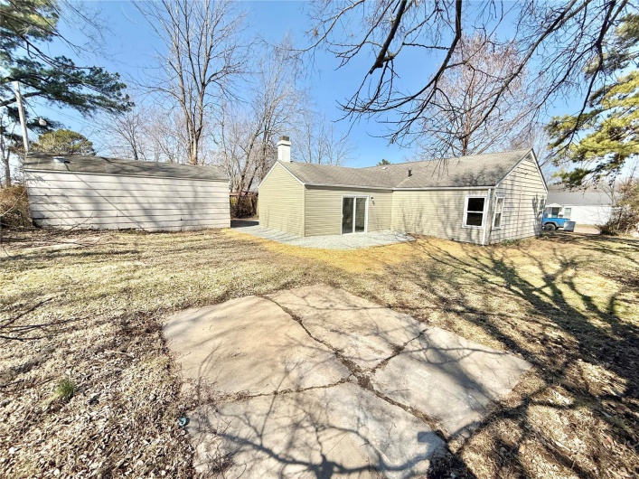 Rear view of house with a chimney