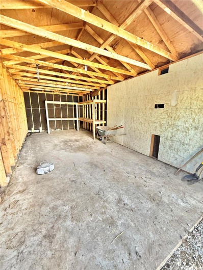 Miscellaneous room with lofted ceiling