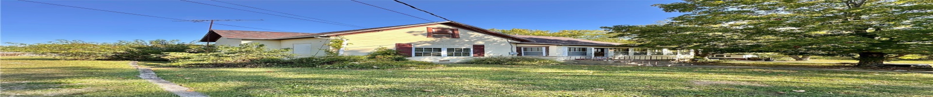 Residential For Sale View of property exterior featuring a yard