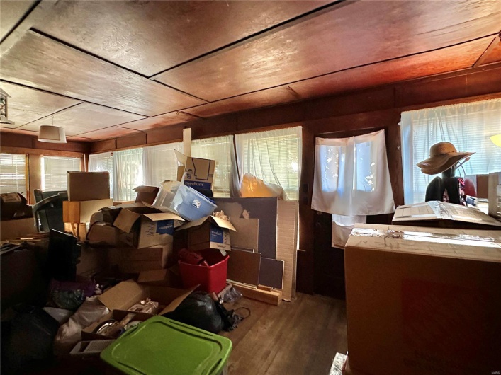 Miscellaneous room with wood-type flooring and a wealth of natural light