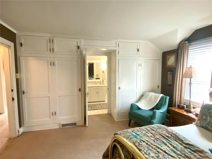 primary bedroom with built in cabinets