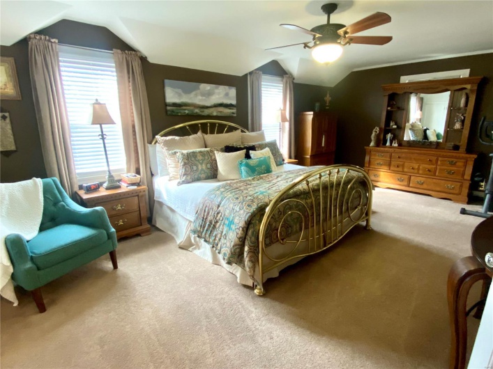 primary bedroom with ceiling fan